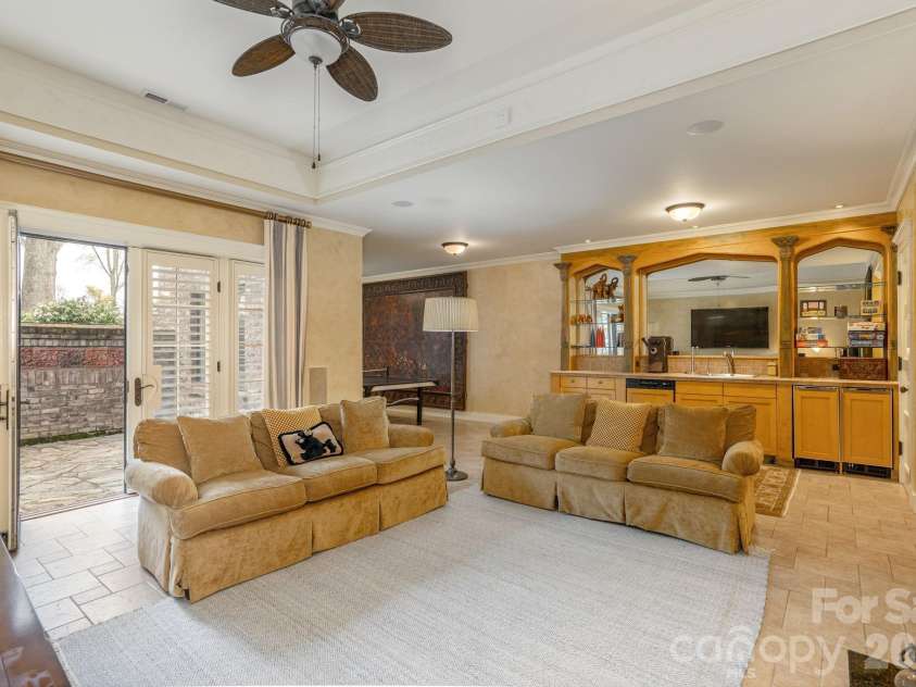 8 Fairway Place, Asheville, NC 28803.  MLS# CAR4245541, YatesRealty ID 2564. Large windows and French doors provide an exit to the outside, offering seamless indoor-outdoor living and easy access to the patio or backyard.