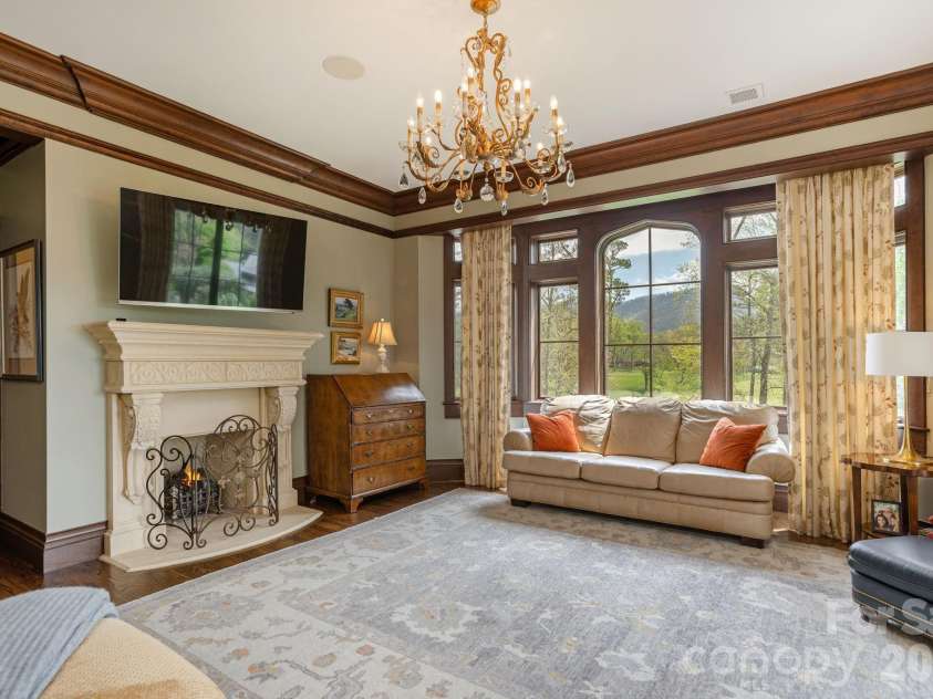 8 Fairway Place, Asheville, NC 28803.  MLS# CAR4245541, YatesRealty ID 2564. Primary bedroom with fireplace, overlooks golf course and mountains.