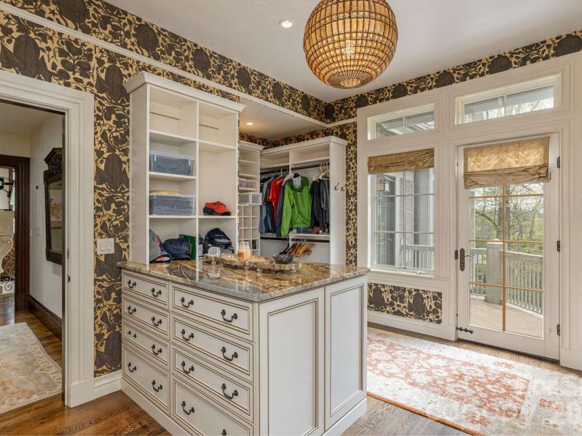 8 Fairway Place, Asheville, NC 28803.  MLS# CAR4245541, YatesRealty ID 2564. Primary dressing room and closet with a balcony.