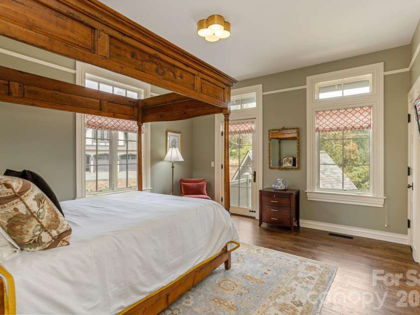 8 Fairway Place, Asheville, NC 28803.  MLS# CAR4245541, YatesRealty ID 2564. Second bedroom connected by a wide hallway flanked with artisan detailing and soft lighting.