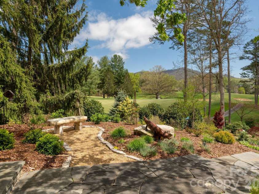 8 Fairway Place, Asheville, NC 28803.  MLS# CAR4245541, YatesRealty ID 2564. So many lovelly resting areas in the garden.  Overlooking the 7th Fairway