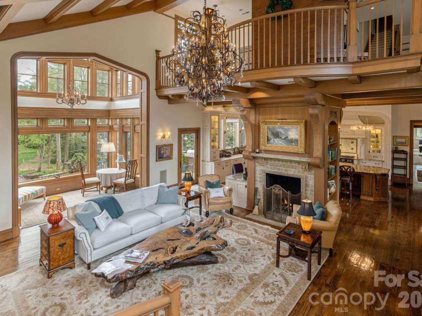 8 Fairway Place, Asheville, NC 28803.  MLS# CAR4245541, YatesRealty ID 2564. The family room opens onto a balcony that overlooks the great hall below, offering a stunning vantage point.