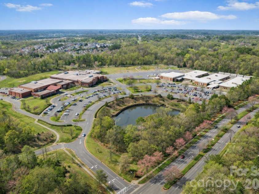 8348 Highland Glen Drive, Charlotte, NC 28269.  MLS# CAR4355382, YatesRealty ID 25649. Trees & grass have been enhanced to depict spring.
