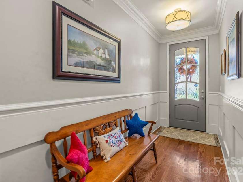 1150 Golden Hill Lane, Denver, NC 28037.  MLS# CAR4278089, YatesRealty ID 25650. Entrance of home with refined crown molding and wainscoting add timeless charm and upscale detail