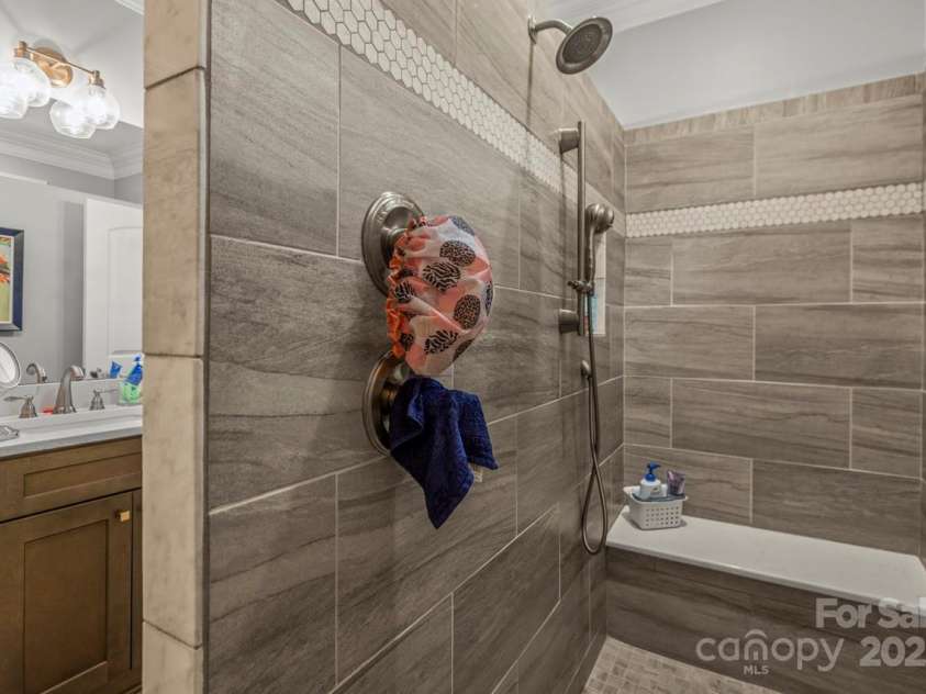1150 Golden Hill Lane, Denver, NC 28037.  MLS# CAR4278089, YatesRealty ID 25650. Indulge in spa-inspired luxury with a fully tiled, oversized walk-in shower featuring a frameless glass entry