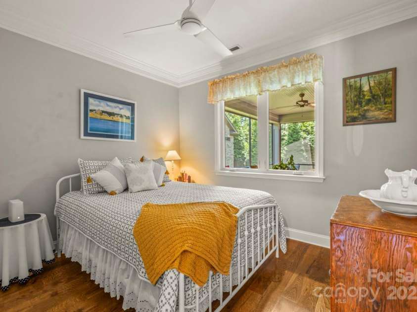 1150 Golden Hill Lane, Denver, NC 28037.  MLS# CAR4278089, YatesRealty ID 25650. This bedroom captures serene views of the screen porch