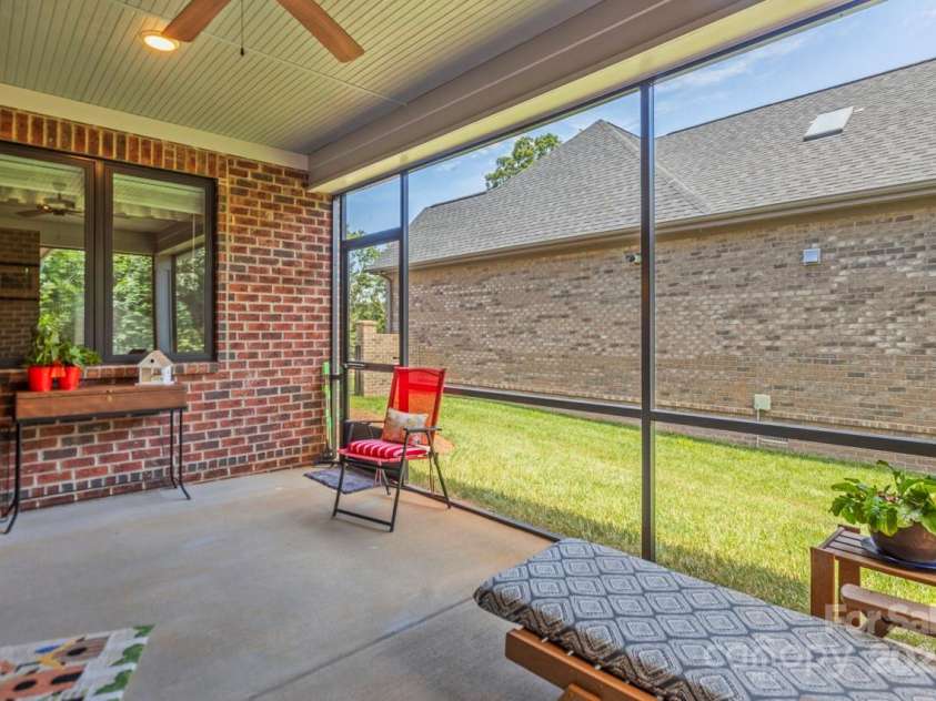 1150 Golden Hill Lane, Denver, NC 28037.  MLS# CAR4278089, YatesRealty ID 25650. This cozy space is perfect for morning coffee, evening reading, or entertaining with friends in total comfort and privacy