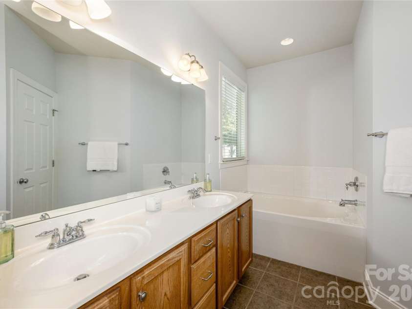 5 Hoolet Court, Biltmore Lake, NC 28715.  MLS# CAR4372678, YatesRealty ID 25665. Dual vanity and soaking tub