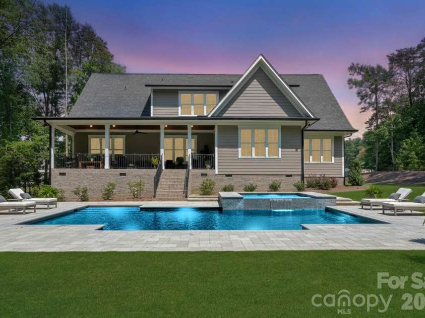 859 Irish Creek Drive, Landis, NC 28088.  MLS# CAR4370059, YatesRealty ID 25668. Rendering with a pool added at twilight