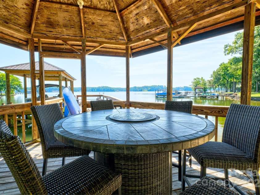 5390 Hudson Road, Lake Wylie, SC 29710.  MLS# CAR4274275, YatesRealty ID 25672. Covered dock seating