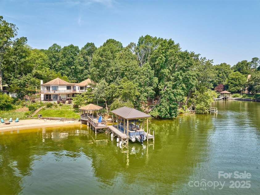 5390 Hudson Road, Lake Wylie, SC 29710.  MLS# CAR4274275, YatesRealty ID 25672. Covered dock with boat lift and cabana area