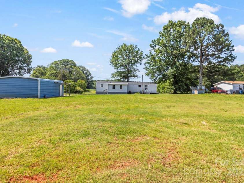 5354 Sherrills Ford Road, Catawba, NC 28609.  MLS# CAR4268743, YatesRealty ID 25674. Rear view of home and garage