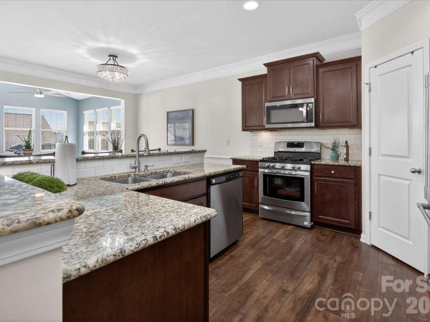 2032 Pinyon Lane, Lancaster, SC 29720.  MLS# CAR4369773, YatesRealty ID 25677. Granite Counters + SS appliances + Updated Lighting in Dining