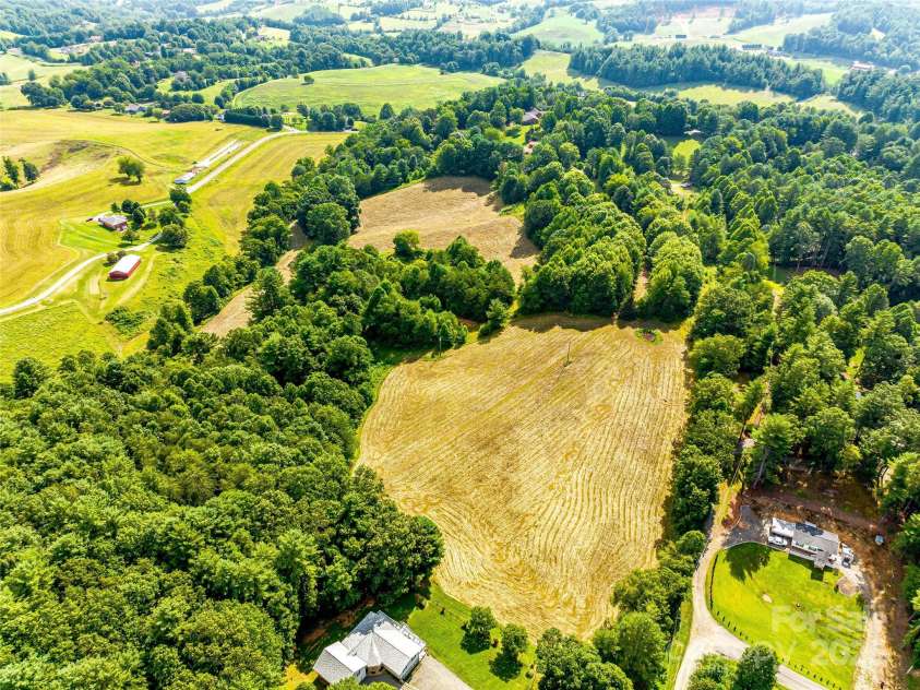 703 Crestview Drive, Leicester, NC 28748.  MLS# CAR4055999, YatesRealty ID 2568. 2 back pasture areas and wooded trail area.