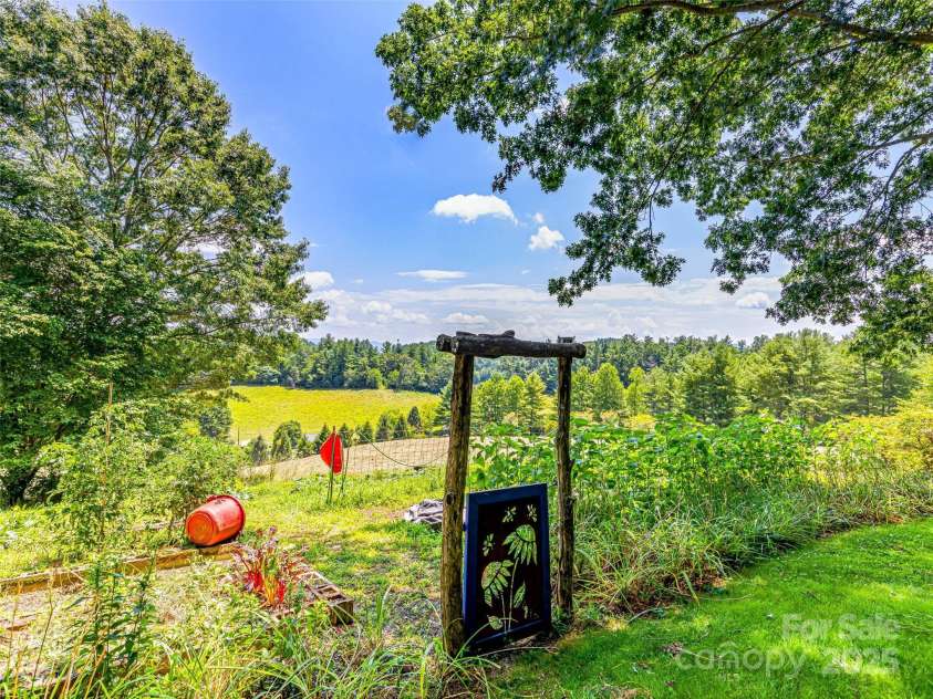 703 Crestview Drive, Leicester, NC 28748.  MLS# CAR4055999, YatesRealty ID 2568. Beautiful outdoor spaces to enjoy.