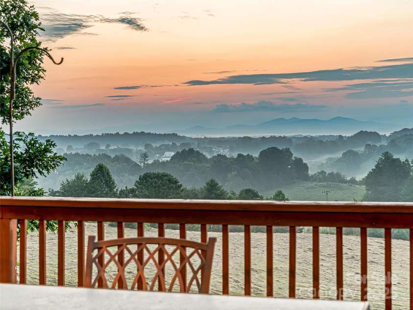 703 Crestview Drive, Leicester, NC 28748.  MLS# CAR4055999, YatesRealty ID 2568. Enjoy beautiful Sunrises on a large deck 