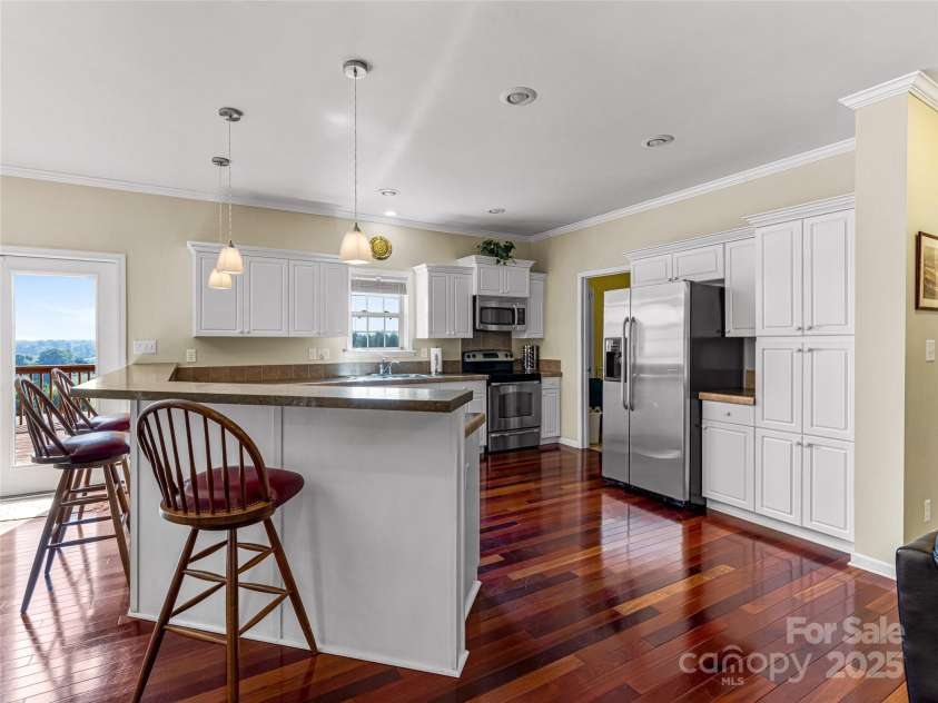 703 Crestview Drive, Leicester, NC 28748.  MLS# CAR4055999, YatesRealty ID 2568. Great Views with a more modern touch in this large open space living area