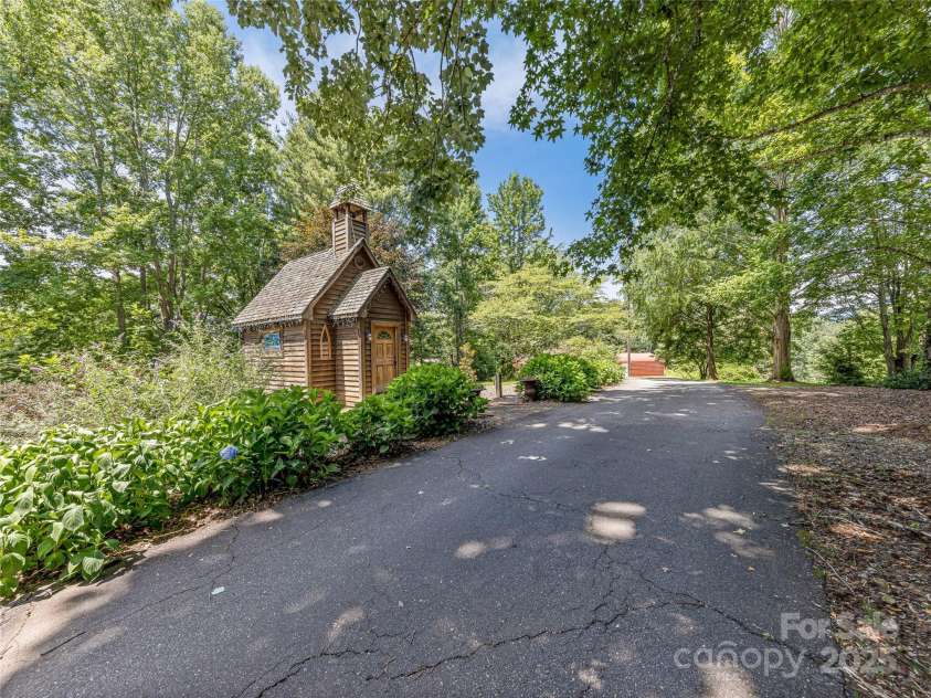 703 Crestview Drive, Leicester, NC 28748.  MLS# CAR4055999, YatesRealty ID 2568. Head past the Chapel to the Barn, Storage areas, Trial and Other Pastures