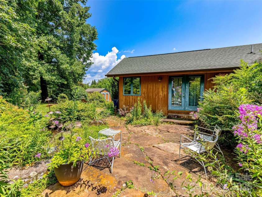 703 Crestview Drive, Leicester, NC 28748.  MLS# CAR4055999, YatesRealty ID 2568. Manicured garden spaces can be found throughout the property.