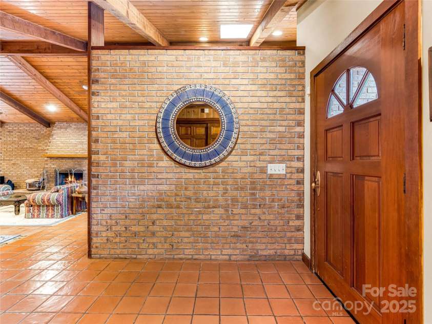 703 Crestview Drive, Leicester, NC 28748.  MLS# CAR4055999, YatesRealty ID 2568. Mid Century Lodge Inspired Main house