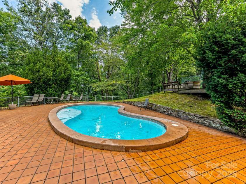 703 Crestview Drive, Leicester, NC 28748.  MLS# CAR4055999, YatesRealty ID 2568. Pool area with Grilling Deck