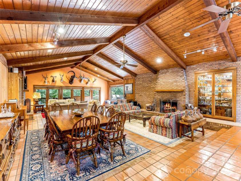 703 Crestview Drive, Leicester, NC 28748.  MLS# CAR4055999, YatesRealty ID 2568. Vaulted Beam ceilings with Spanish Tile Floors 