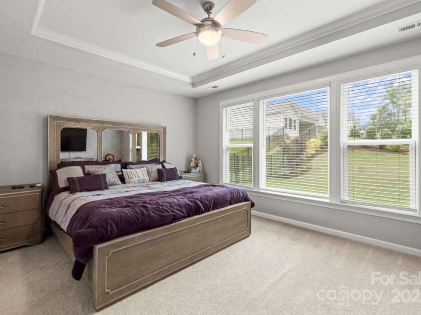 219 Broadleaf Drive, Denver, NC 28037.  MLS# CAR4265284, YatesRealty ID 25691. A wall of windows allows you to capture the captivating views of the back yard