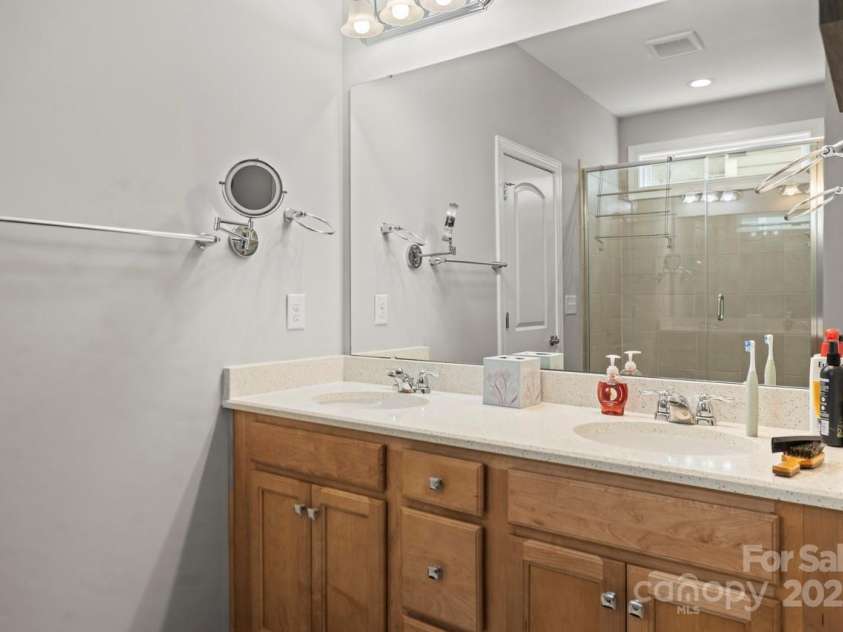 219 Broadleaf Drive, Denver, NC 28037.  MLS# CAR4265284, YatesRealty ID 25691. Double bowl vanity with timeless neutral cabinets