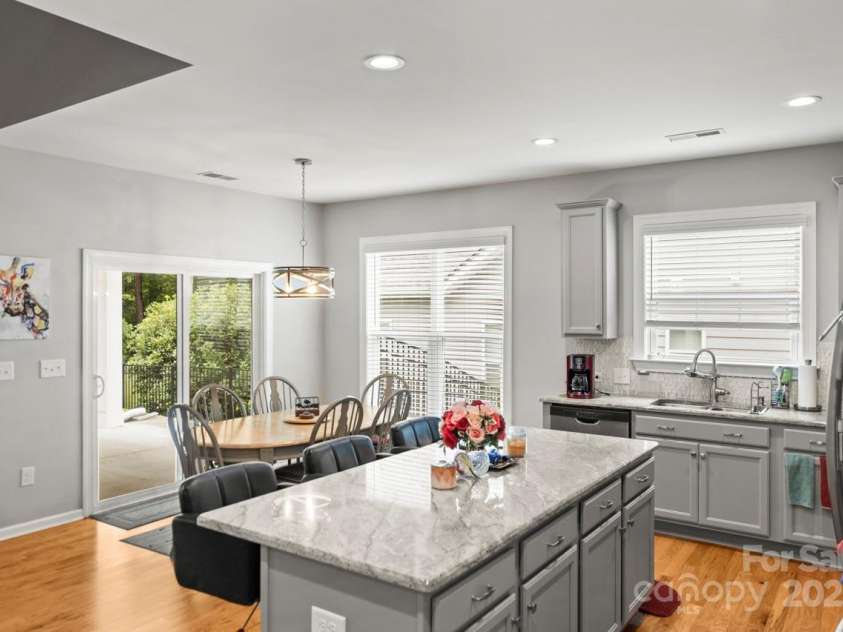 219 Broadleaf Drive, Denver, NC 28037.  MLS# CAR4265284, YatesRealty ID 25691. Sophisticated gray cabinets are a show stopper here and modern, light granite is the perfect topper