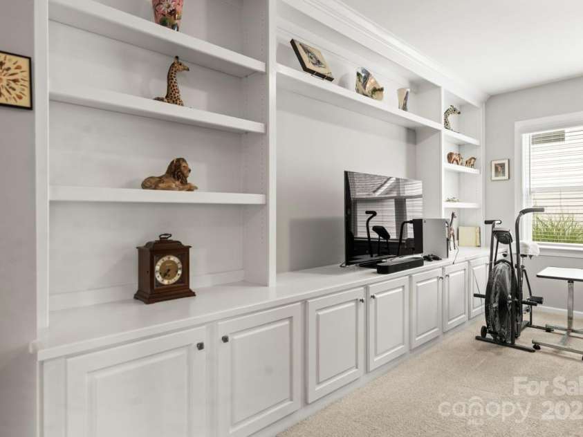 219 Broadleaf Drive, Denver, NC 28037.  MLS# CAR4265284, YatesRealty ID 25691. Upgraded built-in cabinets add functionality to the flex space on the main level