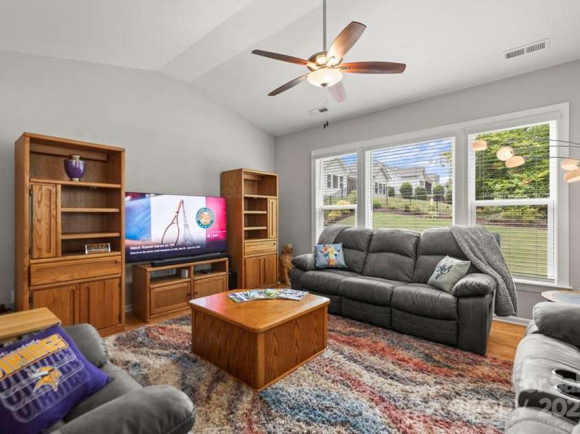 219 Broadleaf Drive, Denver, NC 28037.  MLS# CAR4265284, YatesRealty ID 25691. Vaulted ceiling with fan in the large family room