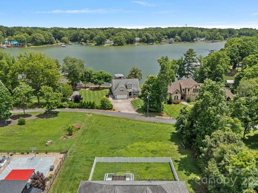 7478 Pine Ridge Drive, Denver, NC 28037.  MLS# CAR4272908, YatesRealty ID 25697. Enjoy living just across the street from Lake Norman—scenic views and serene vibes every day.