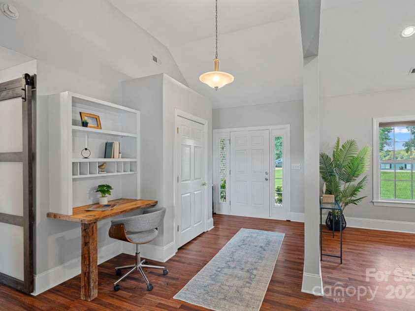7478 Pine Ridge Drive, Denver, NC 28037.  MLS# CAR4272908, YatesRealty ID 25697. Welcoming foyer with built-in desk and shelving—ideal for organizing mail and small tasks.