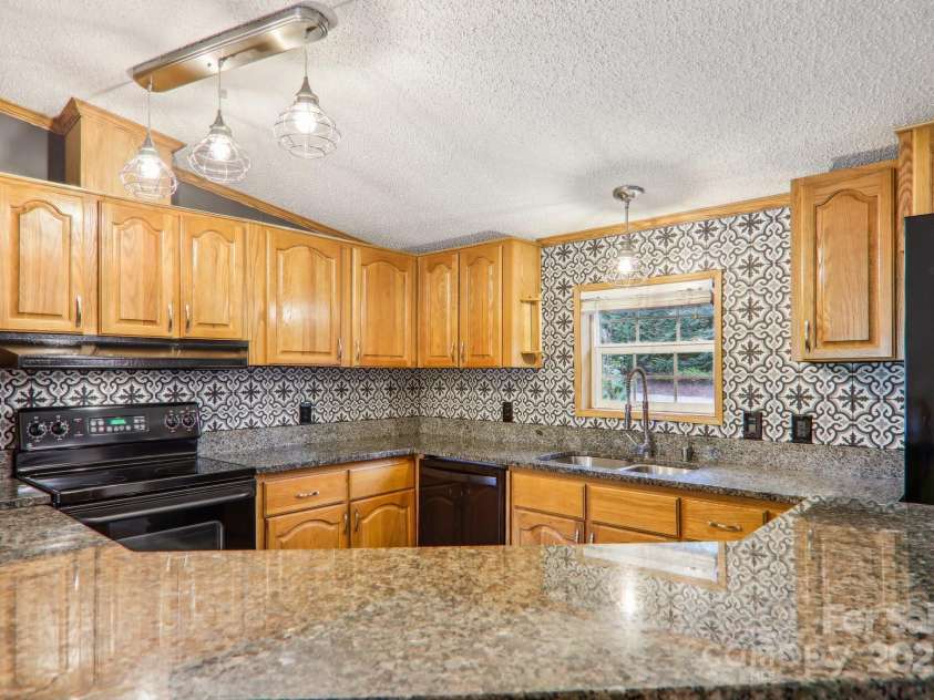 18 Spencer Road, Candler, NC 28715.  MLS# CAR4182190, YatesRealty ID 25702. 