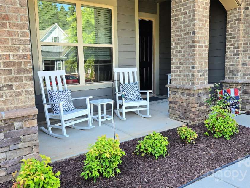 408 Picasso Trail, Mount Holly, NC 28120.  MLS# CAR4278219, YatesRealty ID 25704. Rocking Chair Front Porch