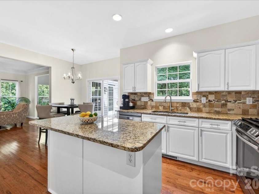 13209 Alex Mill Drive, Pineville, NC 28134.  MLS# CAR4377653, YatesRealty ID 25705. Kitchen island makes food prep a breeze.