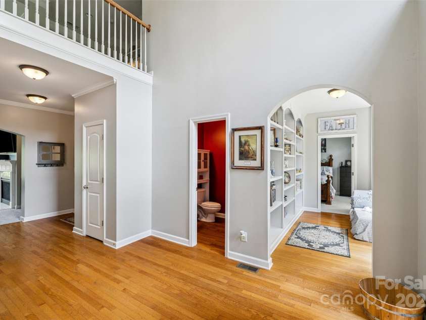 9142 Drayton Lane, Indian Land, SC 29707.  MLS# CAR4275785, YatesRealty ID 25707. Entry way with Library hallway to the main level guest bedroom