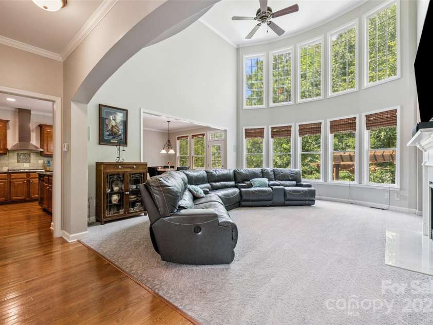 9142 Drayton Lane, Indian Land, SC 29707.  MLS# CAR4275785, YatesRealty ID 25707. Family room with 2 story windows allowing lots of natural light in