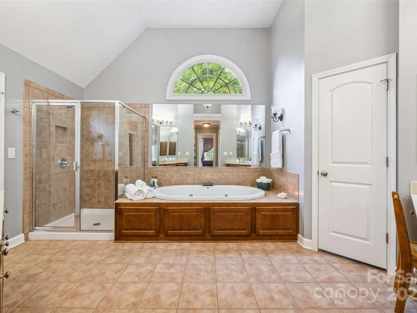 9142 Drayton Lane, Indian Land, SC 29707.  MLS# CAR4275785, YatesRealty ID 25707. Primary bathroom has a walk-in shower and a Jacuzzi tub