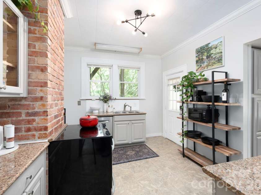 84 Forest Hill Drive, Asheville, NC 28803.  MLS# CAR4381342, YatesRealty ID 25709. Charming Kitchen with Exposed Brick