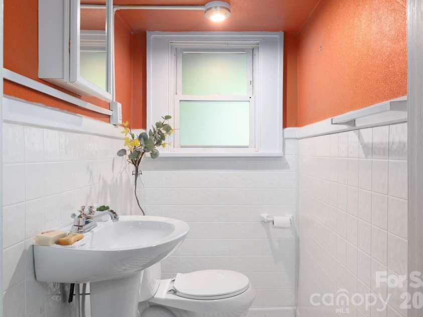 84 Forest Hill Drive, Asheville, NC 28803.  MLS# CAR4381342, YatesRealty ID 25709. Half Bath Next to Main Level Bedroom
