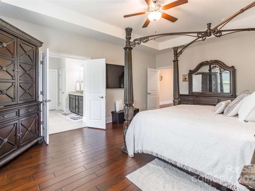 461 Swift Creek Cove, Clover, SC 29710.  MLS# CAR4279534, YatesRealty ID 25712. Hardwood floors in Primary Bedroom