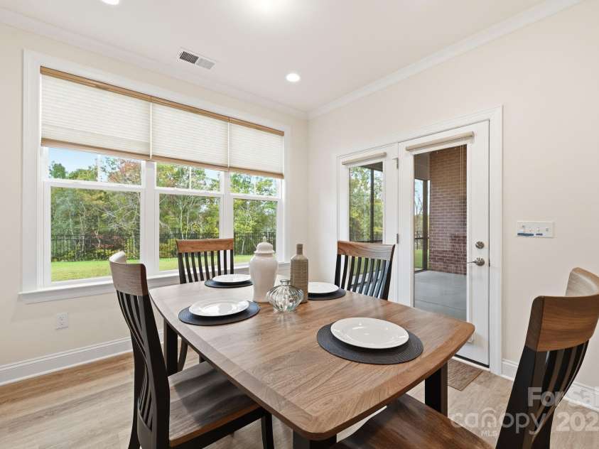 4058 Sagemont Drive, Concord, NC 28027.  MLS# CAR4318082, YatesRealty ID 2572. Breakfast area that opens to screen patio