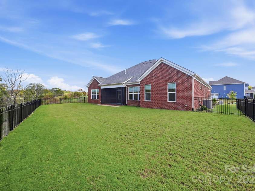 4058 Sagemont Drive, Concord, NC 28027.  MLS# CAR4318082, YatesRealty ID 2572. Flat fenced yard