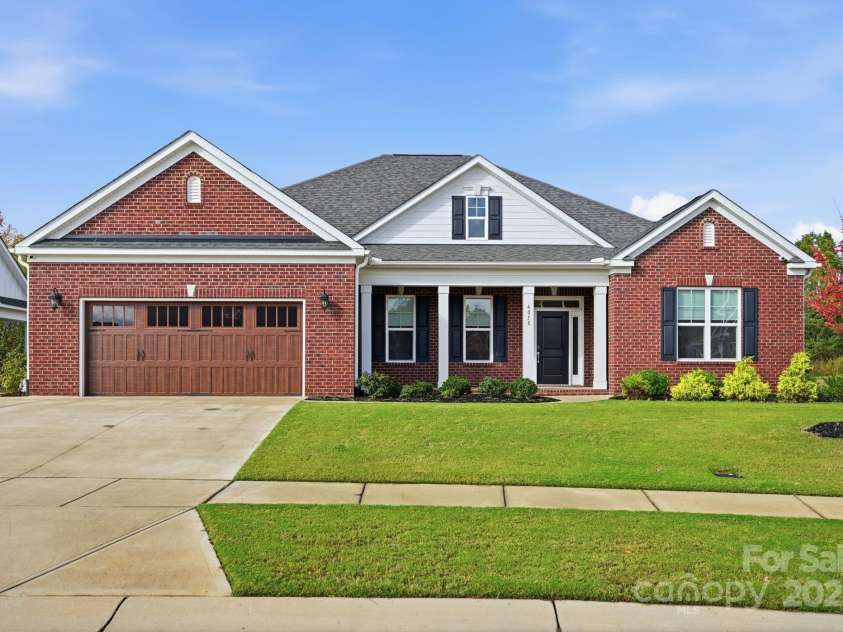 4058 Sagemont Drive, Concord, NC 28027.  MLS# CAR4318082, YatesRealty ID 2572. Full brick home with large driveway