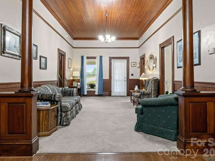 110 Main Avenue, Maiden, NC 28650.  MLS# CAR4385571, YatesRealty ID 25724.  Original columns frame the room like a gallery