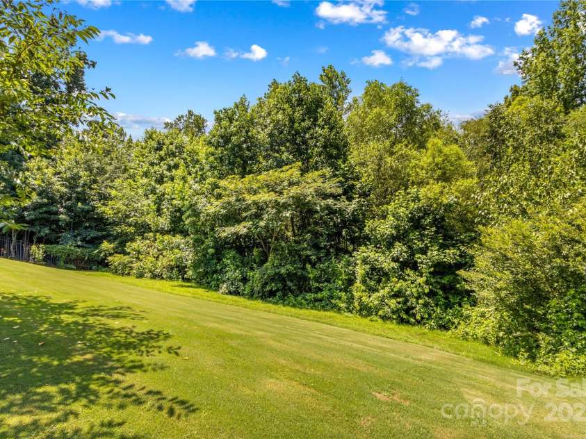 130 Warfield Drive, Mooresville, NC 28115.  MLS# CAR4278096, YatesRealty ID 25728. Back Yard is fenced and borders Trees Greenspace