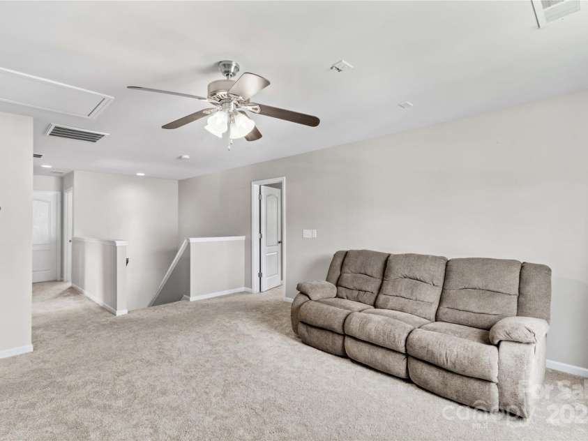 130 Warfield Drive, Mooresville, NC 28115.  MLS# CAR4278096, YatesRealty ID 25728. Ceiling Fan in Bonus Room