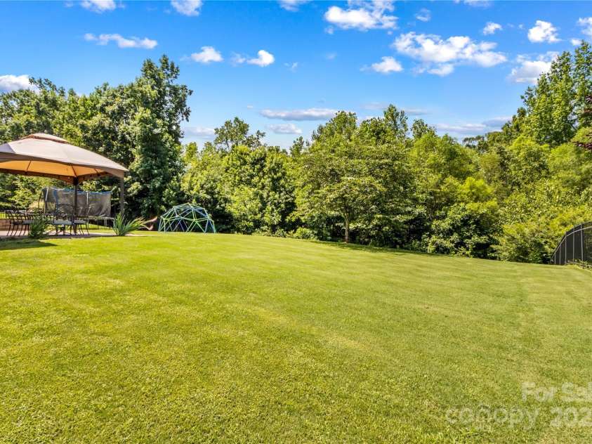 130 Warfield Drive, Mooresville, NC 28115.  MLS# CAR4278096, YatesRealty ID 25728. Gorgeous Back Yard
