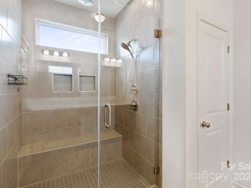 117 Carmine Court, Troutman, NC 28166.  MLS# CAR4269982, YatesRealty ID 2573. Upgraded luxury shower with frameless glass
